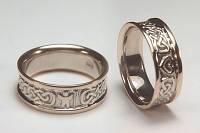 Personalized Lindesfarne Knot Wedding Bands in two tone gold
