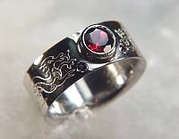 14KT white gold reverse etch dragon band with bezel set garnet