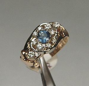 Diamond and sapphire cluster ring in 14kt two tone