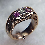Custom Photoetched ring with emerald cut diamond and pink sapphires