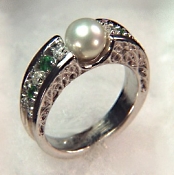 Custom Photoetched ring with emerald cut diamond and pink sapphires