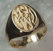 Photoetched 14kt yellow gold signet ring with the initials A J W