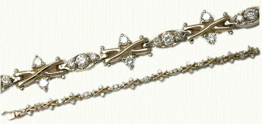 Diamond Bracelet. This is a 14kt yellow gold X-link bracelet with over 3cts 