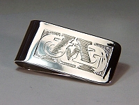 Hand engraved sterling silver money clip with the initials J L M