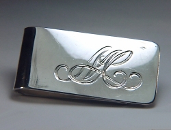Hand engraved sterling money clip with initials M L C